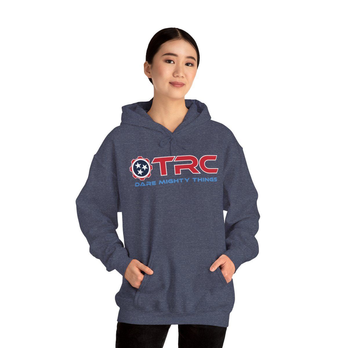 Person wearing a navy hoodie with TRC logo, hands in pockets, on a white background