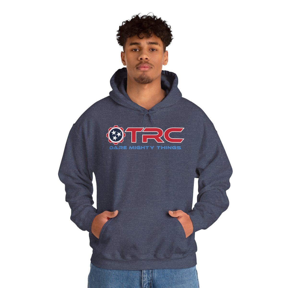 Man in a navy hoodie with TRC logo, hands in pockets, against a white background