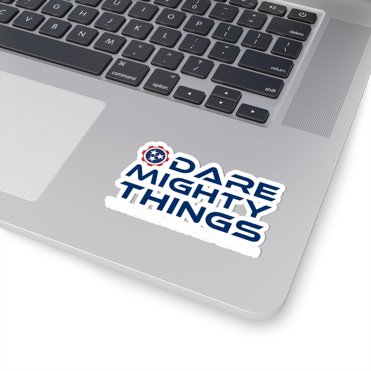 Blue and red “DARE MIGHTY THINGS” logo with stars emblem on white background