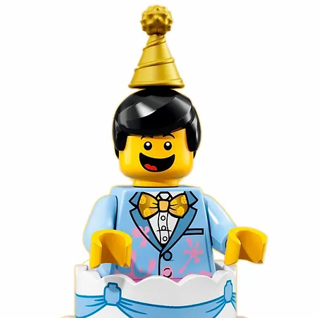Lego minifigure of a man in a cake with a blue suit, yellow bow tie, and party hat.