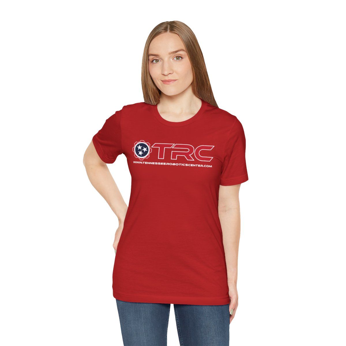 Woman modeling a red T-shirt with a white logo, standing against a plain white background
