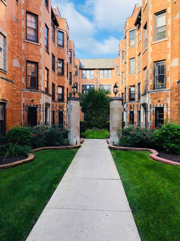Walkway into beautiful brick apartment complex