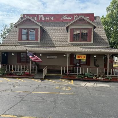 Local Flavor restaurant with a brown exterior, American flag, and 