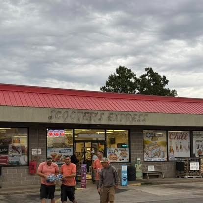 Scooter's Express store with customers carrying items. Cloudy sky above.