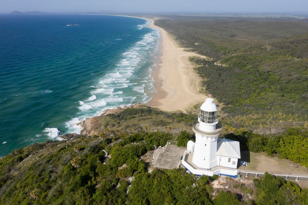 An Aerial View Of A Lighthouse On Top Of A Hill Next To A Beach — Port Macquarie Locksmiths In South West Rocks, NSW