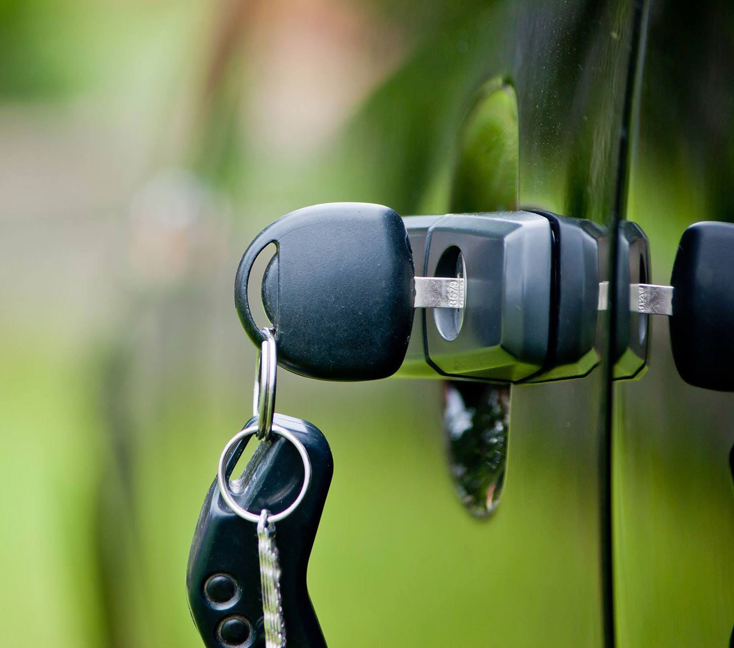A Close Up Of A Car Door With Two Keys In It — Port Macquarie Locksmiths In Port Macquarie, NSW