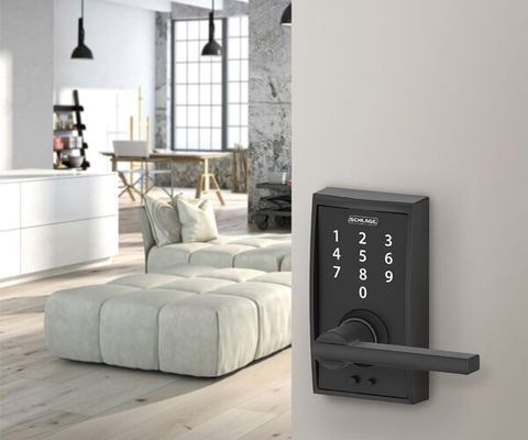 A Living Room With A Couch And A Door Lock — Port Macquarie Locksmiths In Port Macquarie, NSW