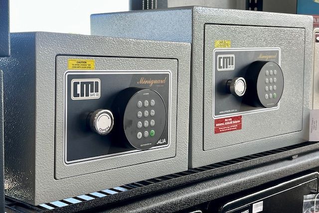 Two Safes Are Sitting On Top Of Each Other On A Shelf — Port Macquarie Locksmiths In Port Macquarie, NSW