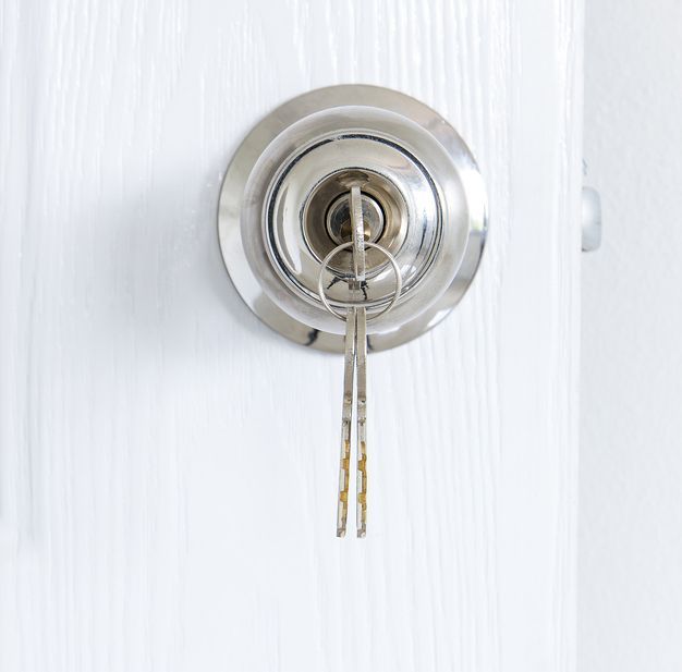 A Close Up Of A Door Lock With A Key In It — Port Macquarie Locksmiths In Port Macquarie, NSW