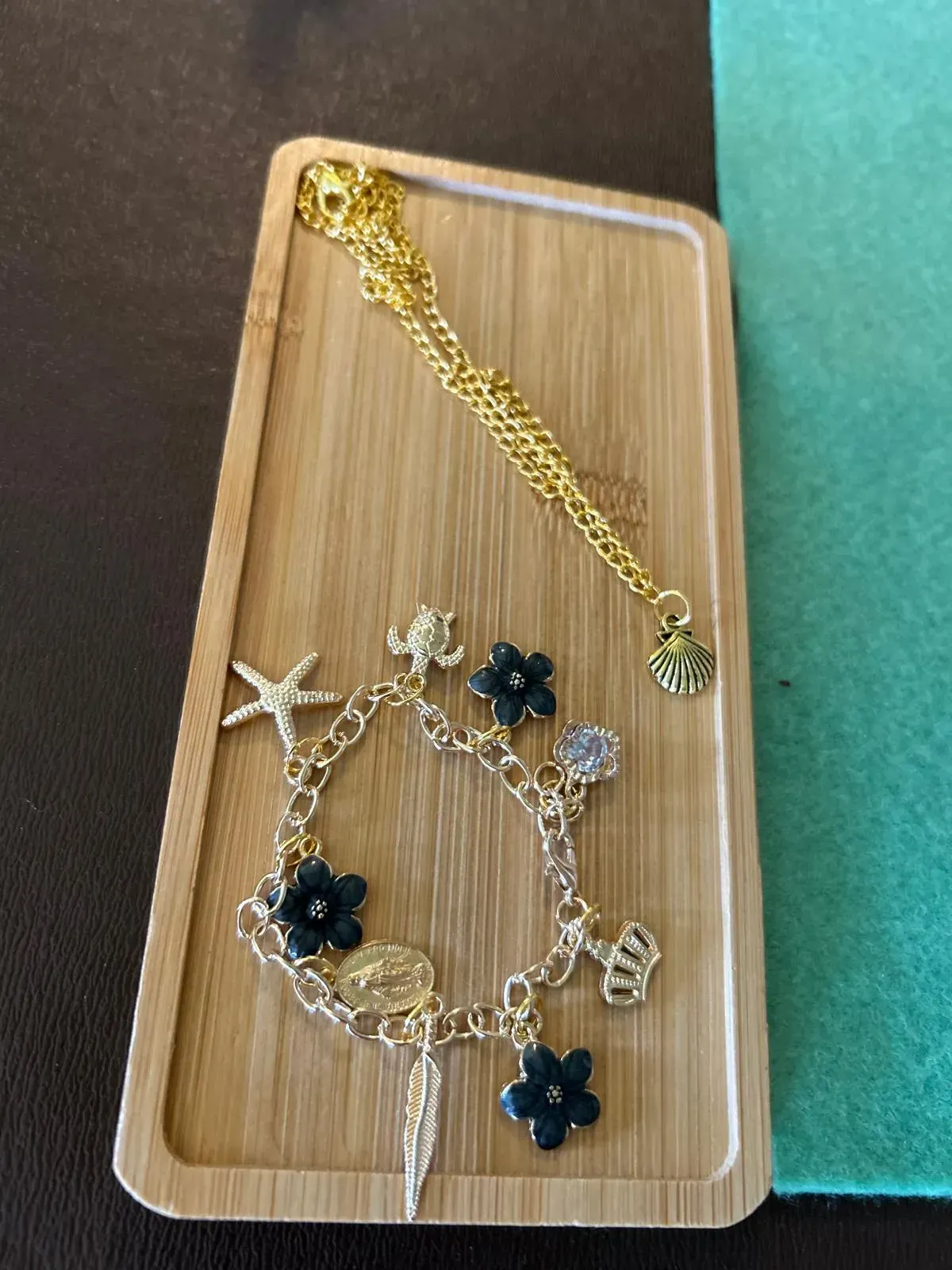 A group of women are sitting at a table in a room for charm party  at Dragonfly crafts parties