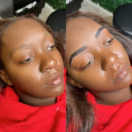 A woman is laying down with her eyes closed and her eyebrows painted.
