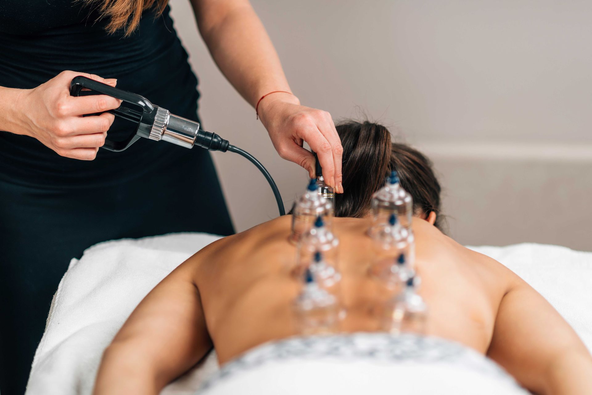 Back massage with cupping therapy in a spa setting