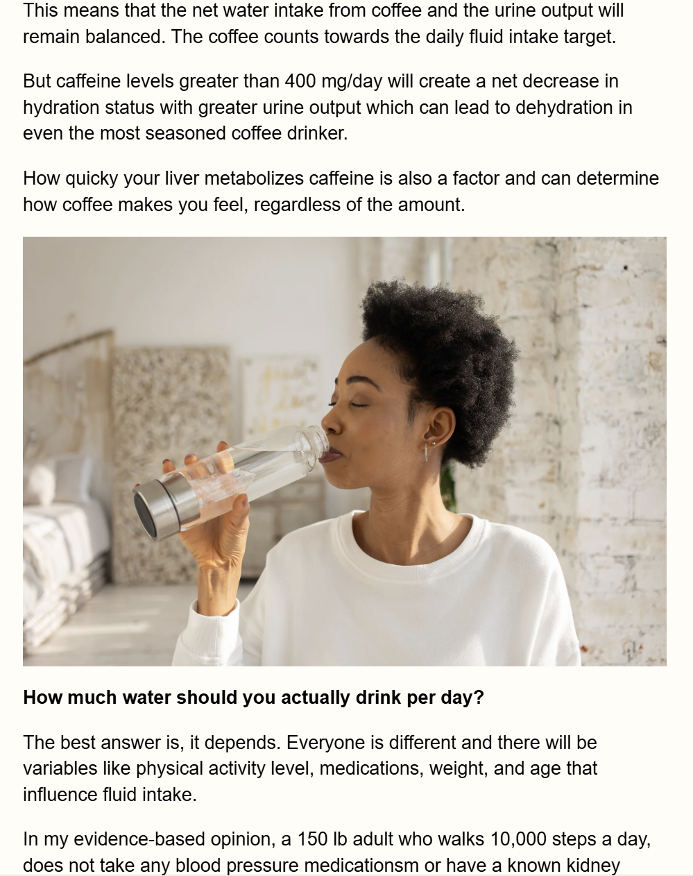 Woman drinking water from a glass beside article text in a bright kitchen