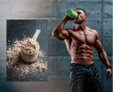 Muscular athlete drinking from a green shaker beside a scoop of protein powder on a gray background