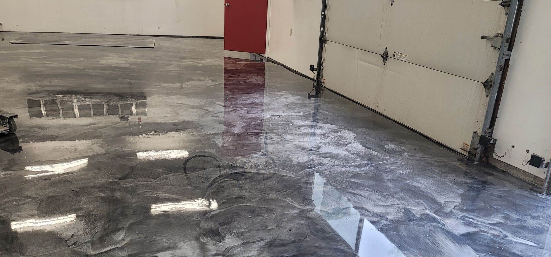 A garage with a shiny floor — San Leandro, CA — Mission Flooring and Countertop Design