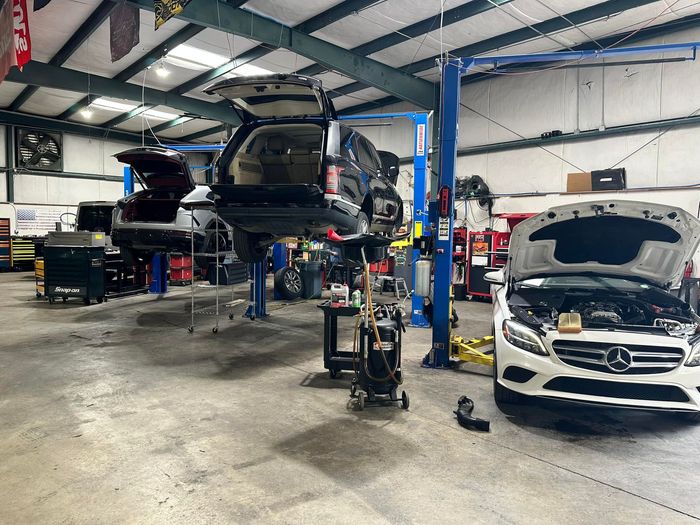 European Vehicles Raised On Lifts During Diagnostic Service | UAC