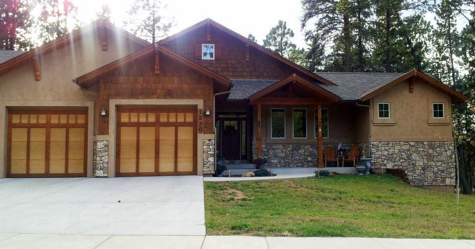 A large house with a lot of garage doors