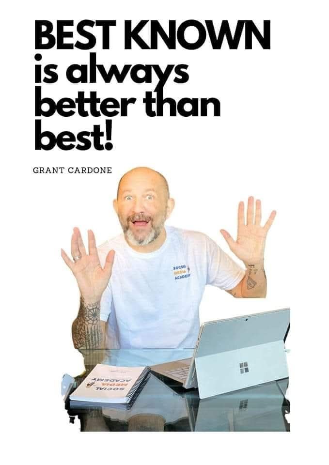 Man with open palms, smiling, at a desk with laptop and books. Text above: 