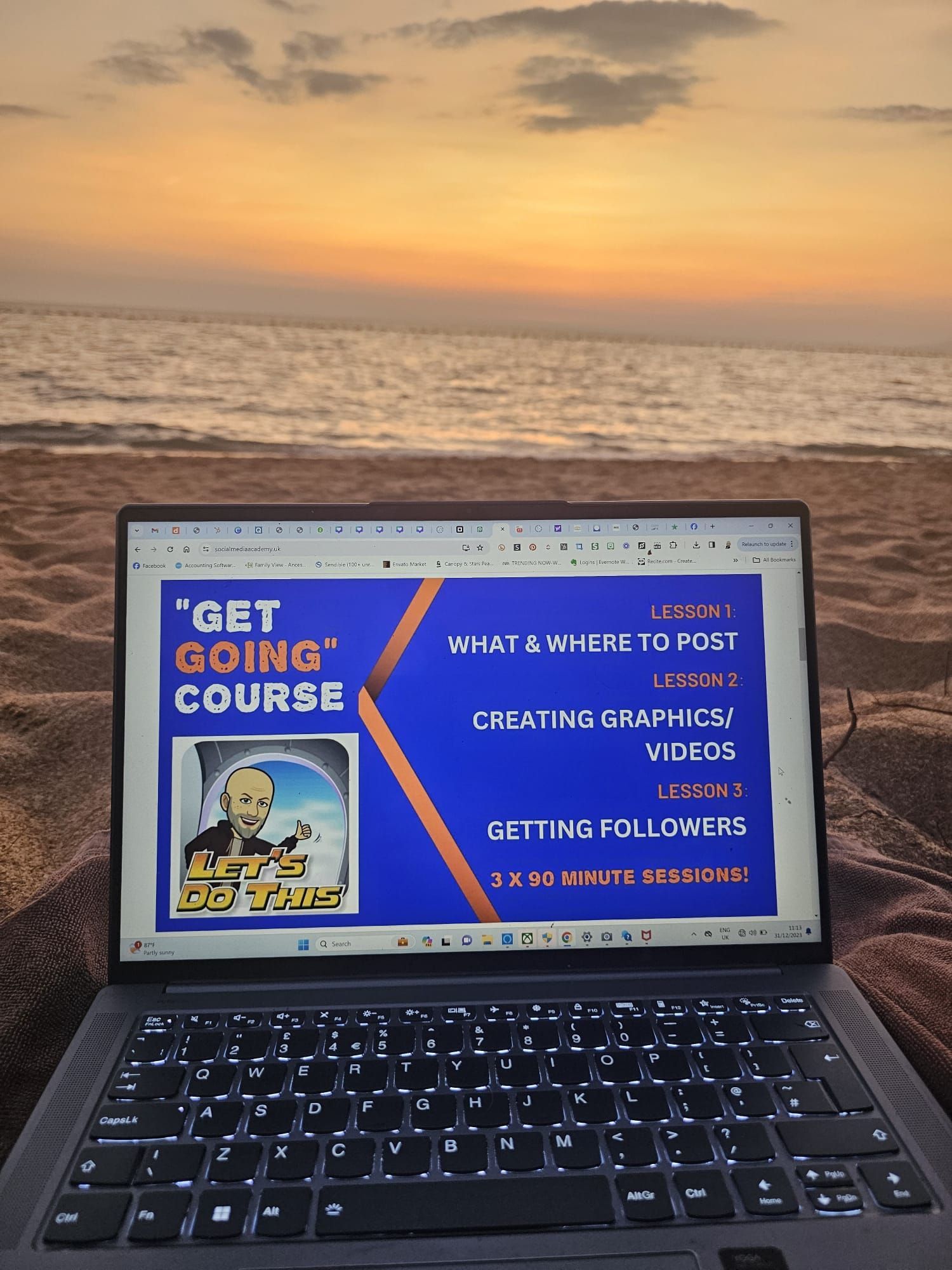 Laptop on beach showing a