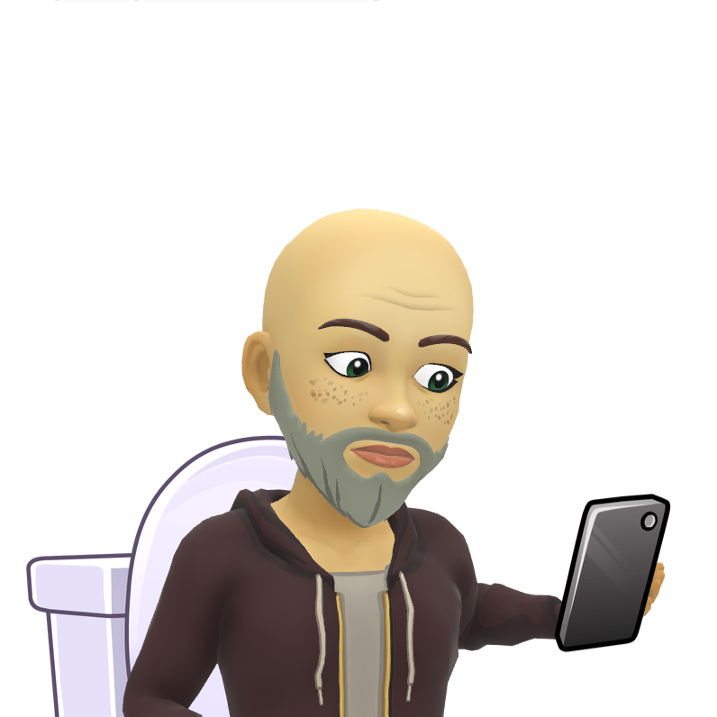 A bald man with a beard is sitting in a toilet holding a cell phone.