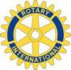 A yellow and blue rotary international logo on a white background.