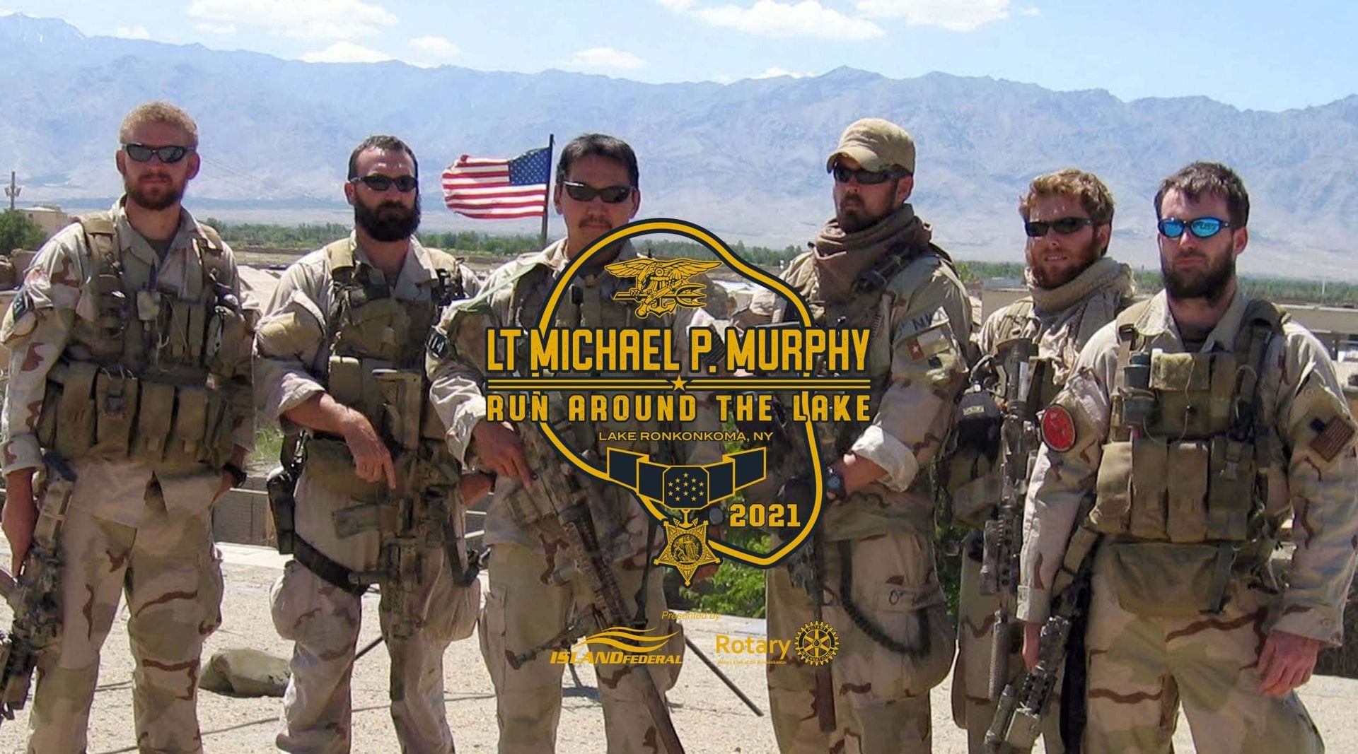 A group of soldiers are standing next to each other in front of an american flag.