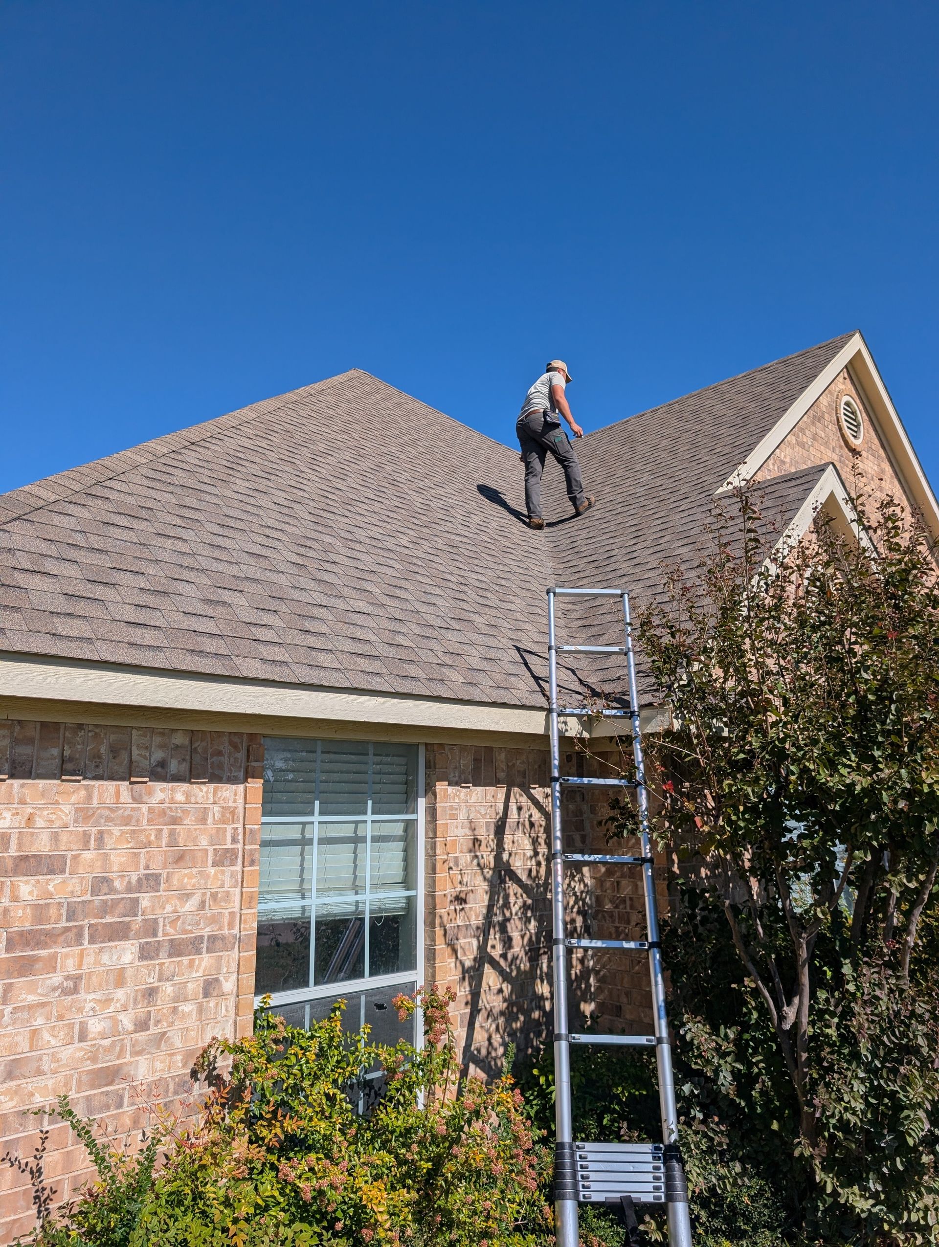 A person stands on a roof