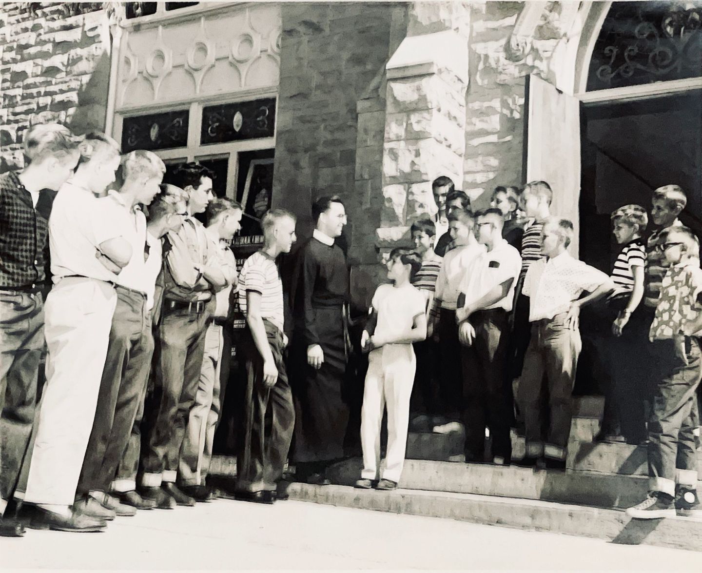 Black and white image of boys outside.