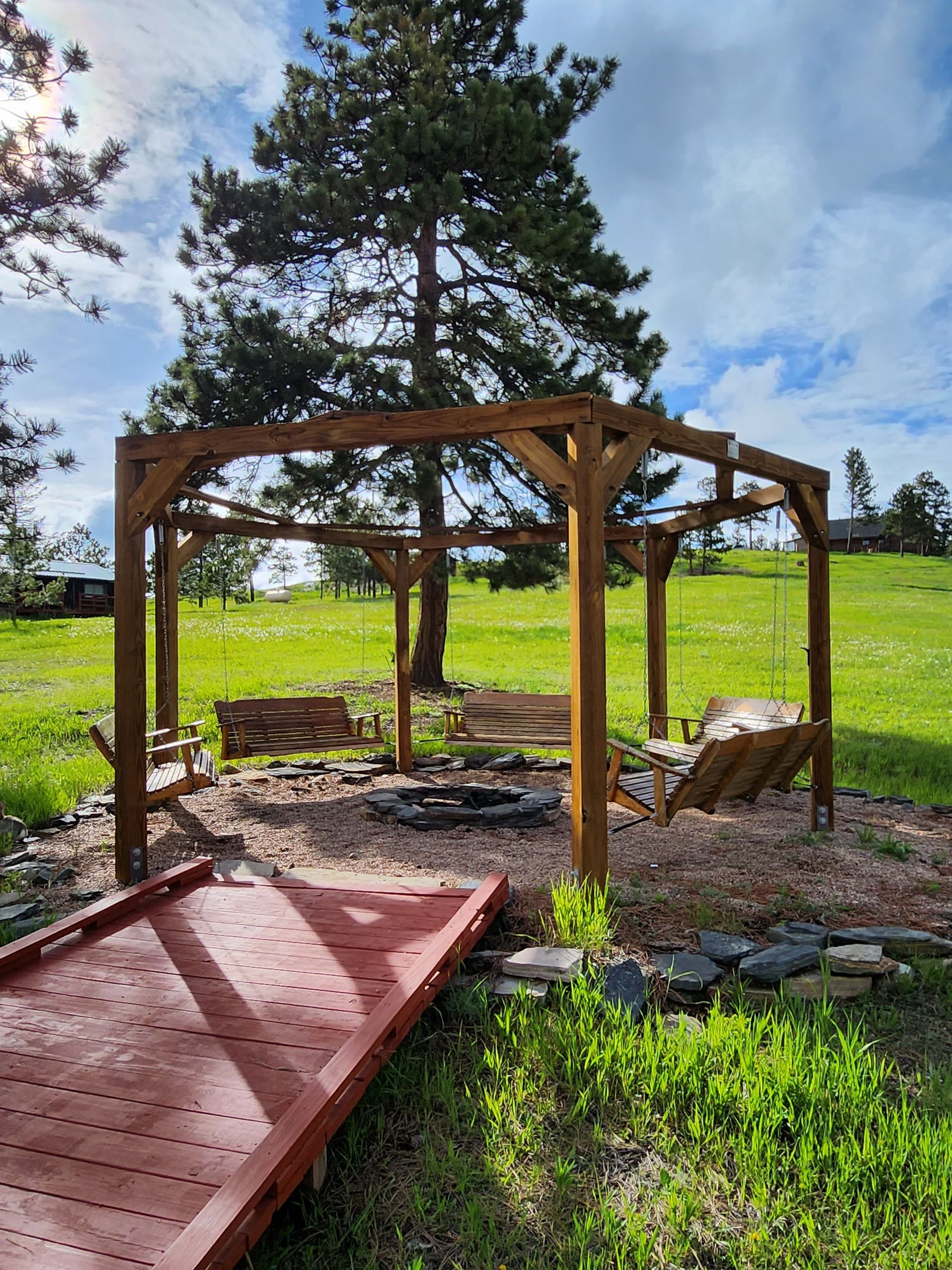 Firepit with bench swings.