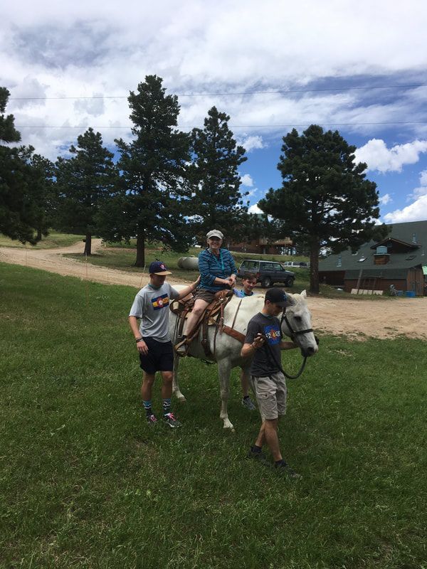 Camp Hope camper riding on horse.