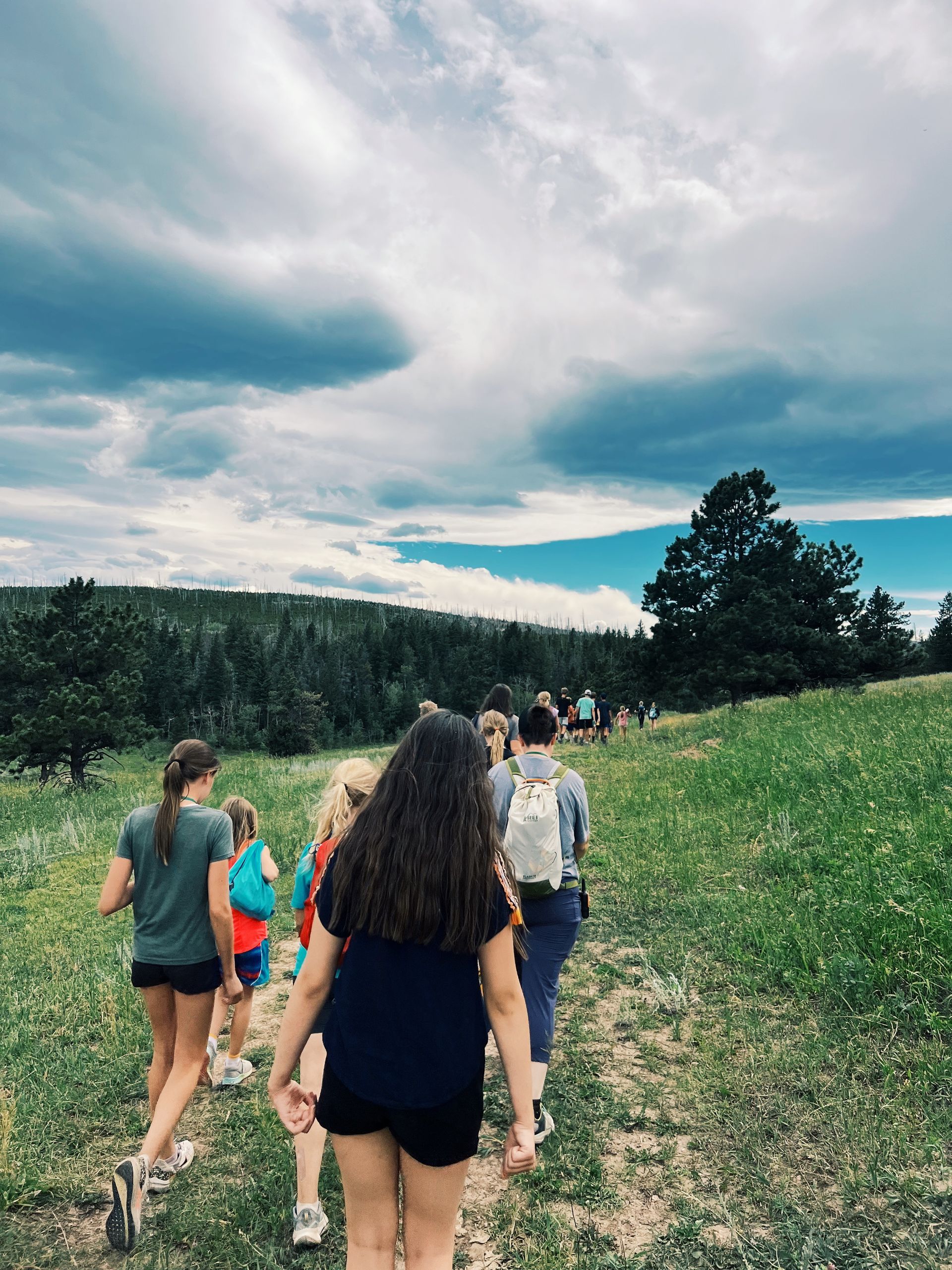 View of campers hiking on trail