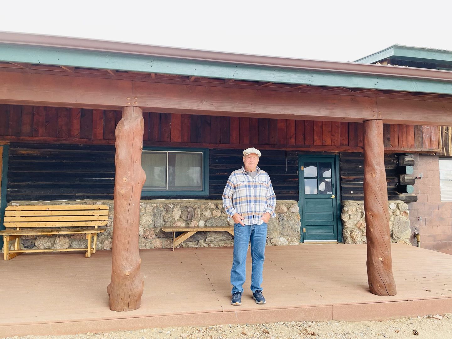 Man standing on deck of Buckhorn Lodge.
