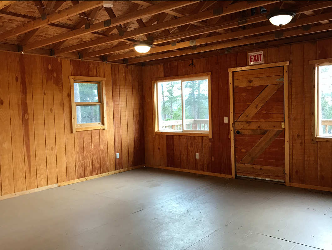 Interior view of Miner's cabin unfurnished.