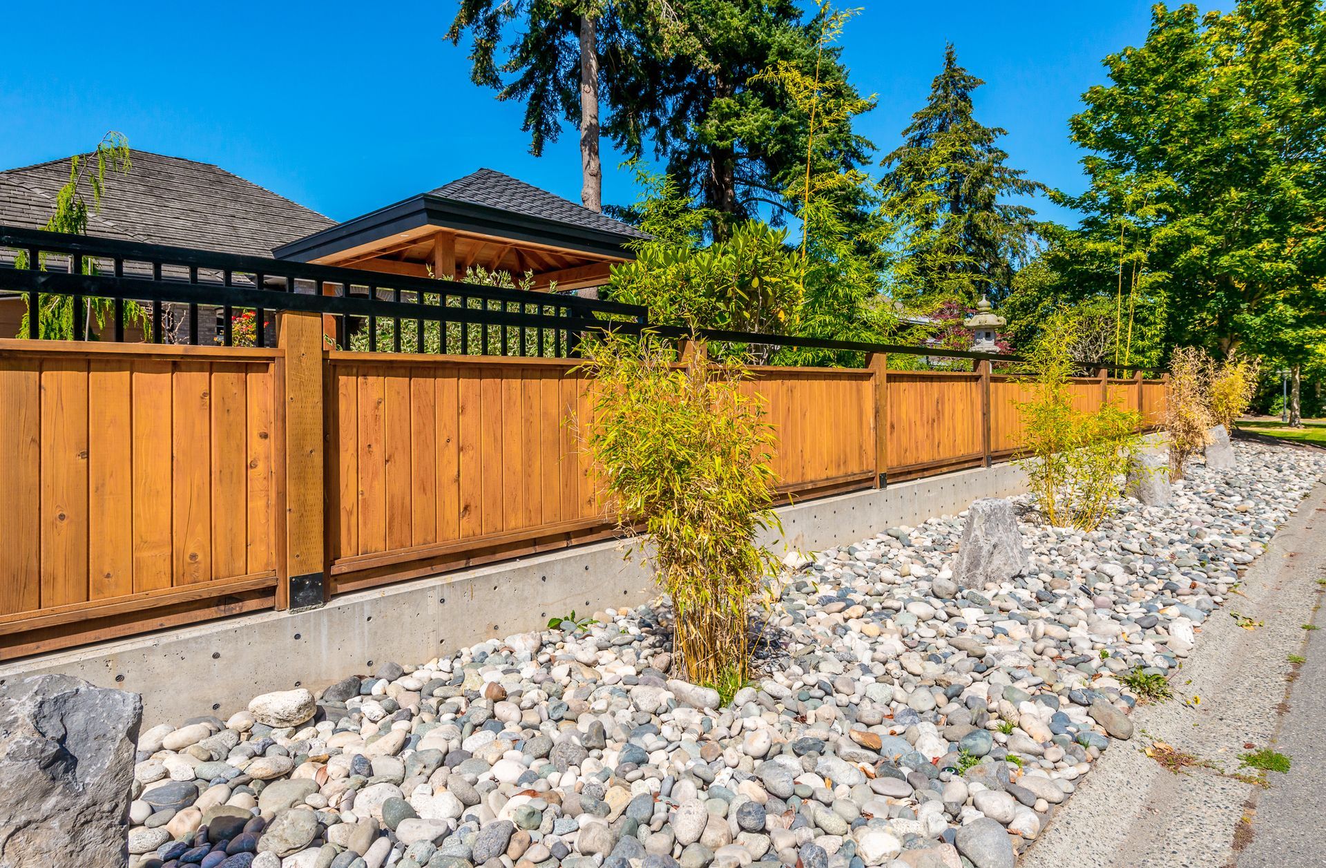 Wooden fence with black railing
