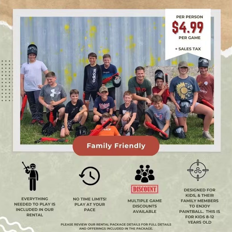 A group of young boys are posing for a family friendly paintball game
