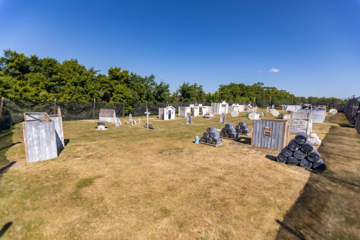 A group of people are playing paintball in a field.