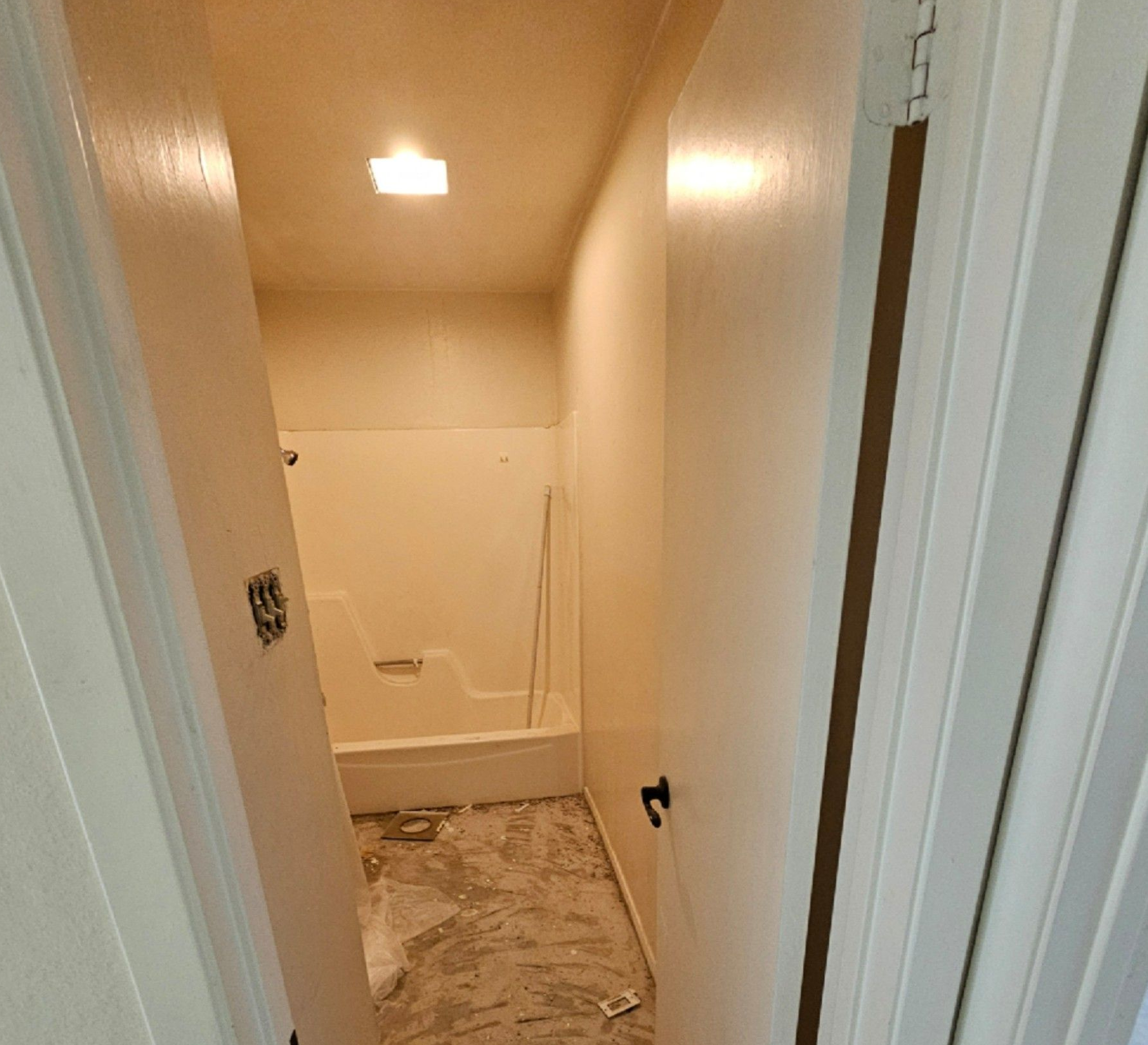 Damaged bathroom sink countertop with missing faucet parts and scattered debris