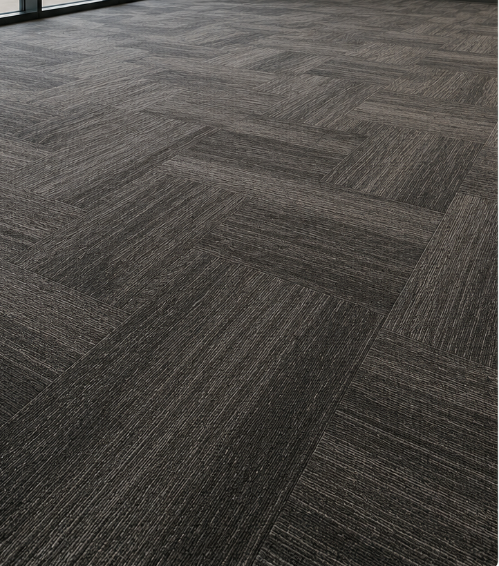 Gray carpet tiles in a diagonal pattern on an office floor