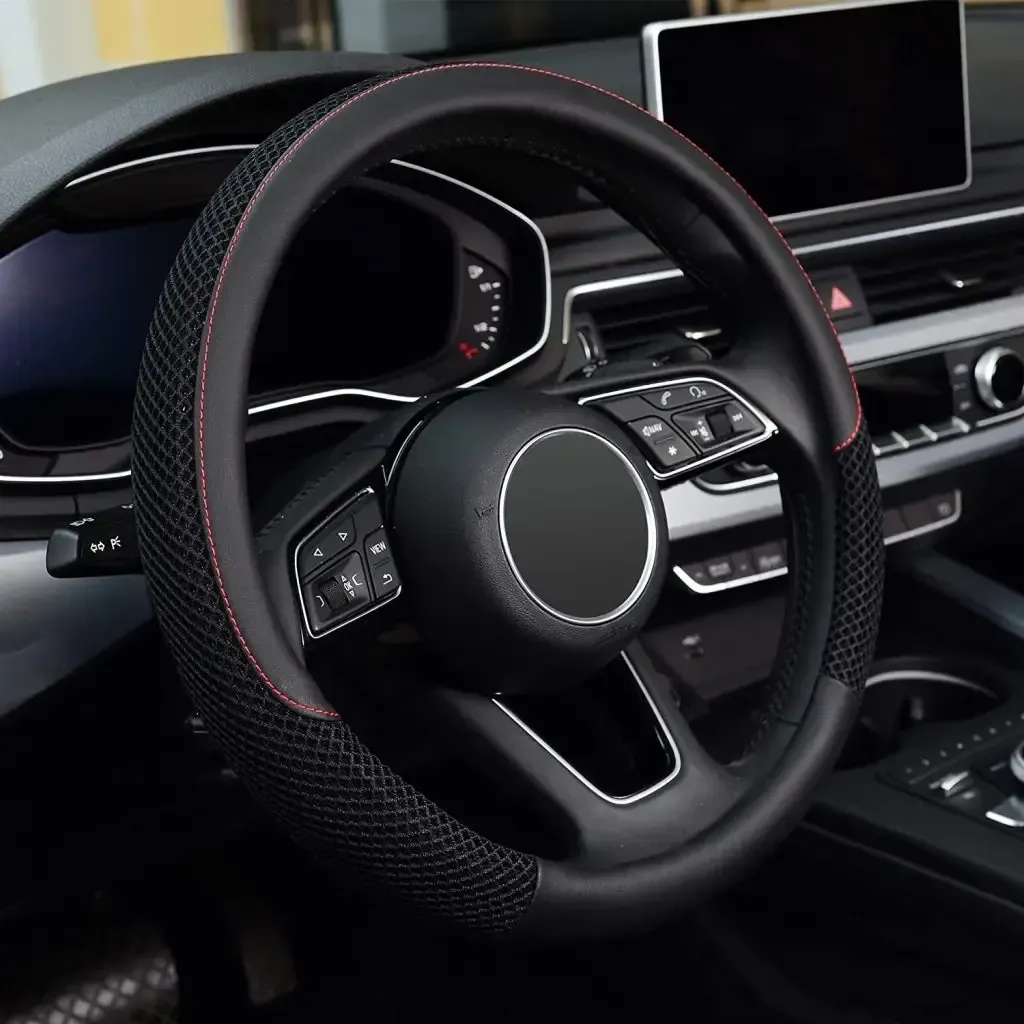 A close up of a steering wheel in a car