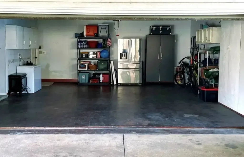 A garage with a lot of shelves and a sink