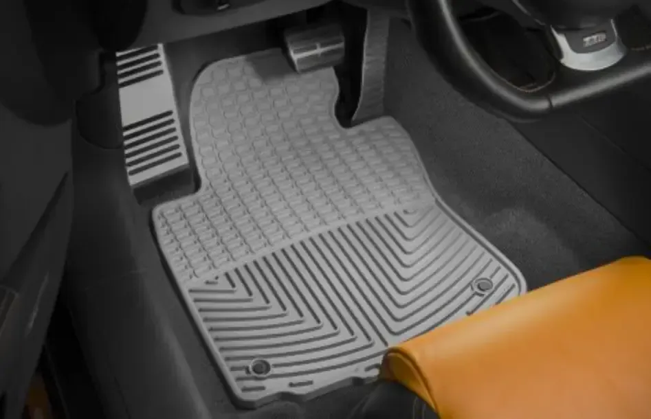 A close up of a car floor mat in a car.