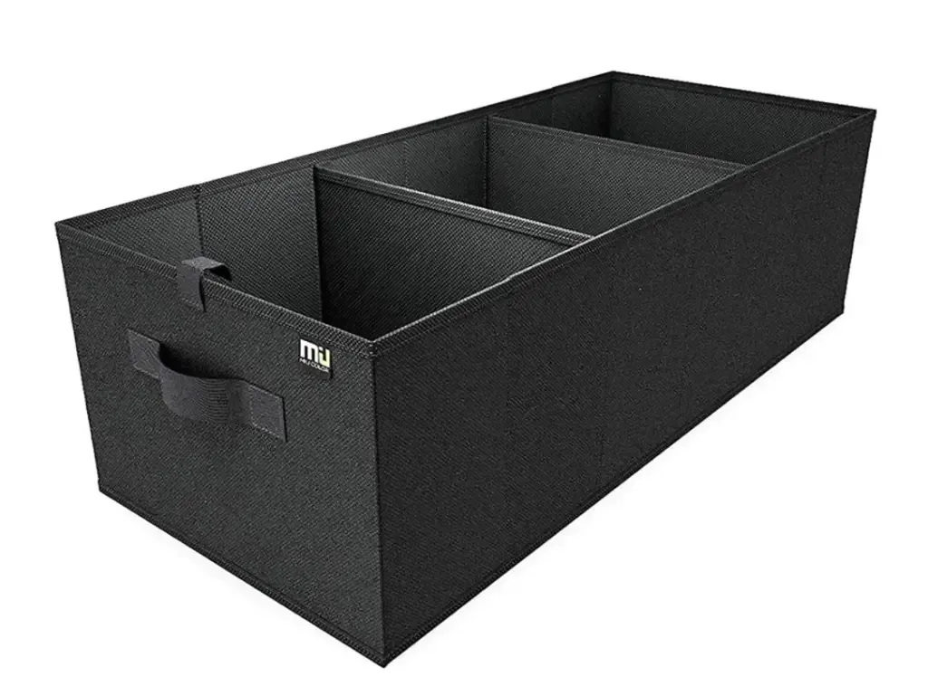 A black box with a handle and the word mu on it