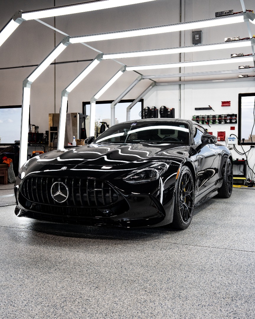 Glossy blue car outside Fort Worth Auto Detail