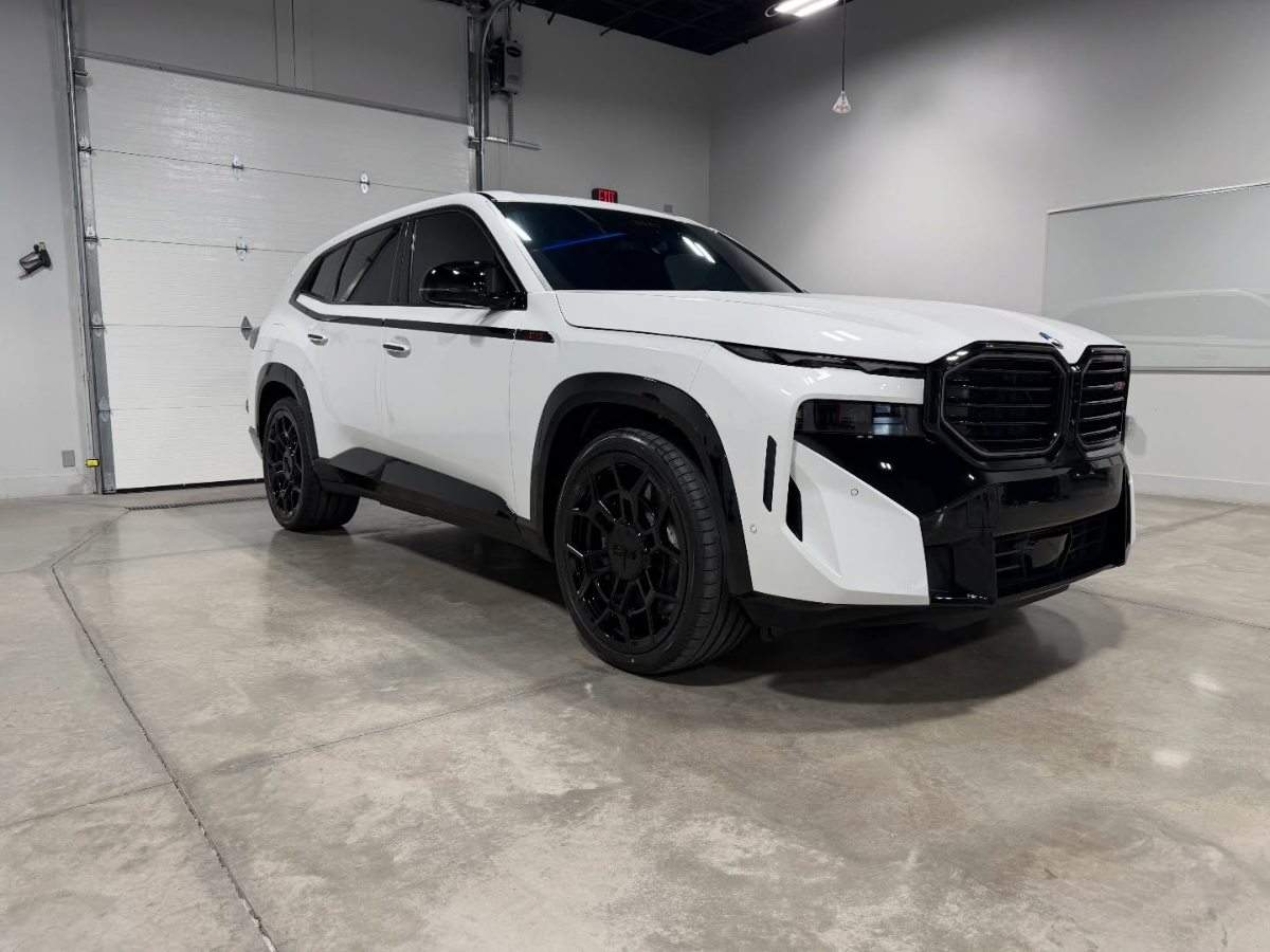White BMW SUV parked in garage