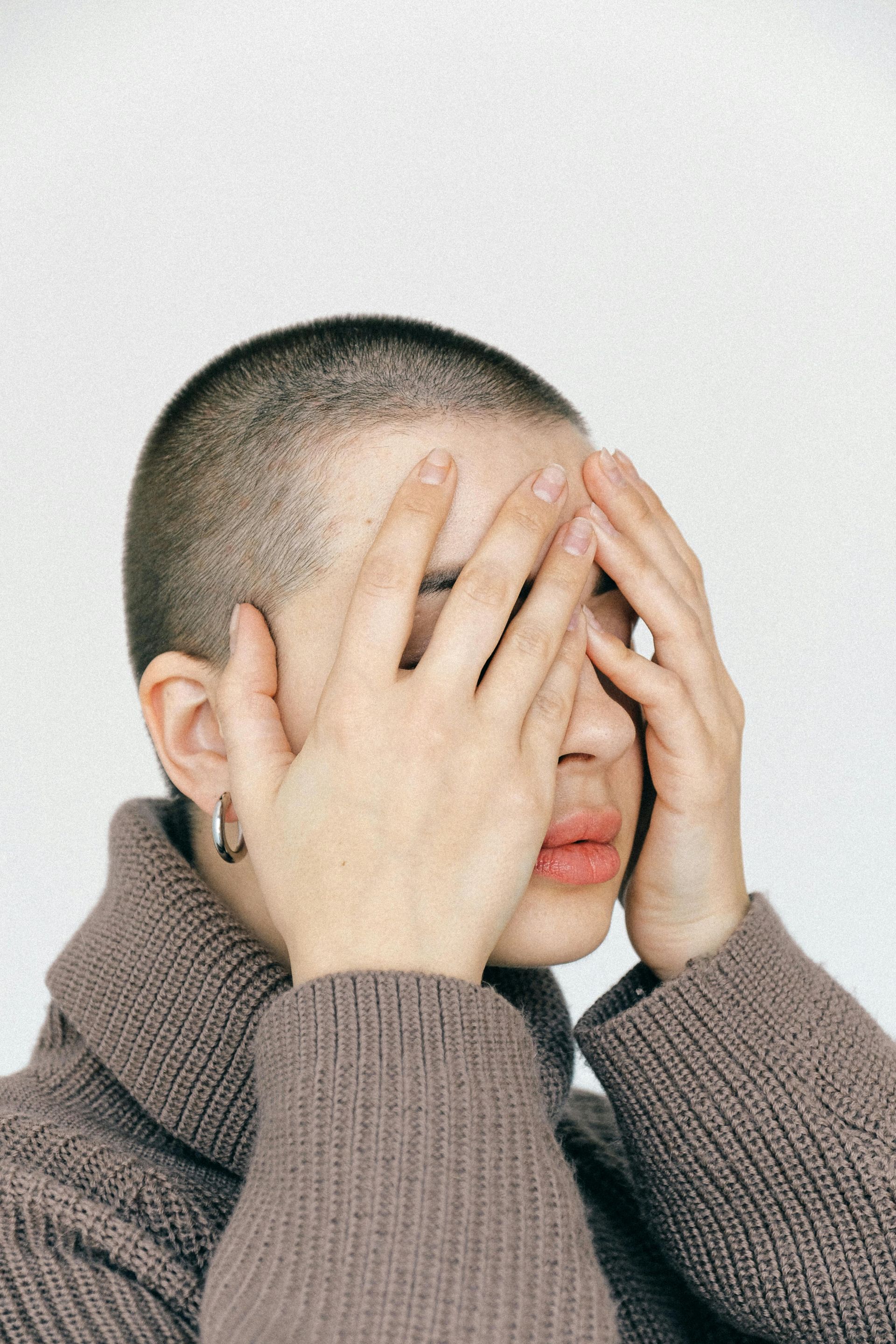 Woman covering her eyes