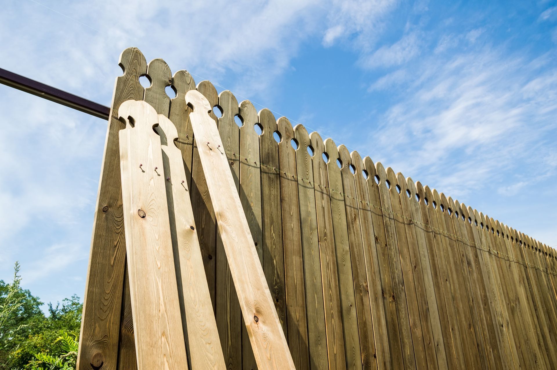 Installing a new wooden fence.