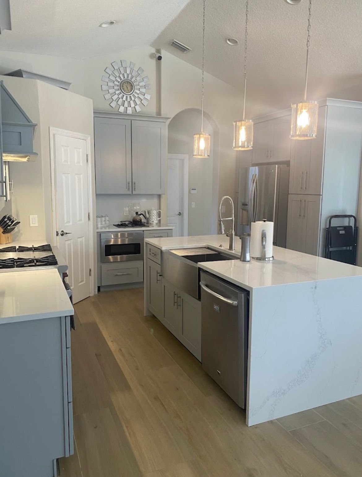A Kitchen with A Large Island and Stainless Steel Appliances