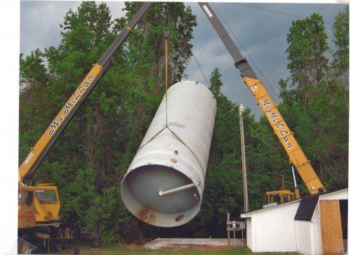 White Tank Being Lifted By Crane - Dallas, NC - McMillan Crane Services Inc.