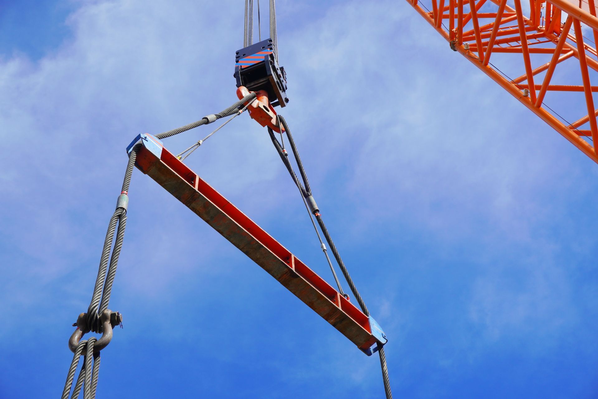 Crane is lifting the machine using spreader bar and sky background in a chemical factory. Crane is lifting the machine using spreader bar and sky background in a chemical factory.