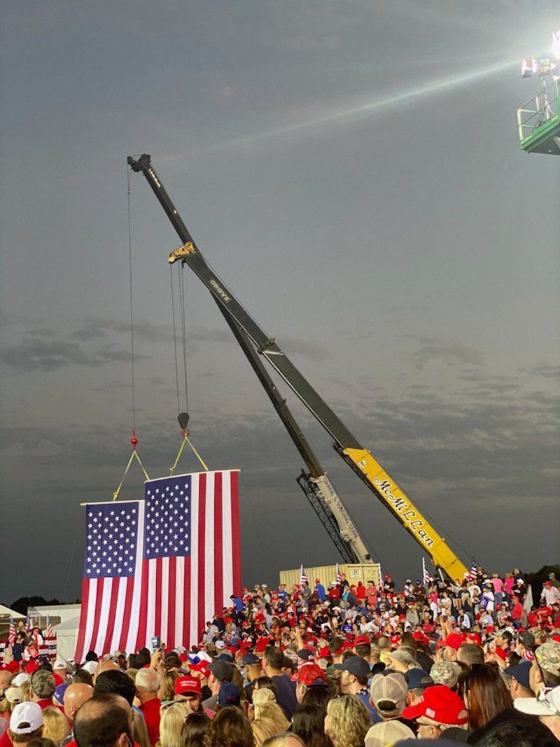 Crane Lifting Two American Flags - Dallas, NC - McMillan Crane Services Inc.